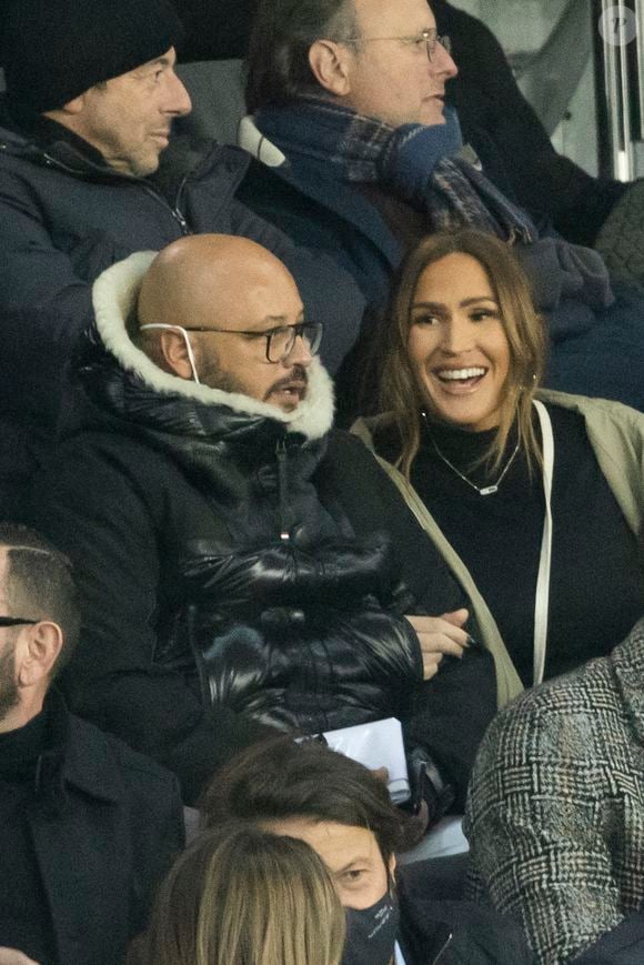 Vitaa (enceinte de son 3ème enfant) et son mari Hicham Bendaoud - People lors de la huitième de finale aller de la Ligue des champions entre le PSG et le Real Madrid au Parc des Princes à Paris le 15 février 2022. © Cyril Moreau/Bestimage