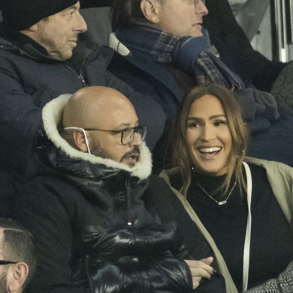 Vitaa (enceinte de son 3ème enfant) et son mari Hicham Bendaoud - People lors de la huitième de finale aller de la Ligue des champions entre le PSG et le Real Madrid au Parc des Princes à Paris le 15 février 2022. © Cyril Moreau/Bestimage