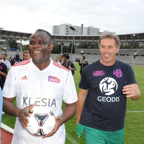 Basile Boli et Laurent Blanc - Match pour Thierry Roland et pour les 80 ans du football professionnel. Match de Gala, opposant le Varietes Club de France à la selection republicaine au Stade Charlety a Paris le 12 Septembre 2012.