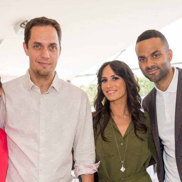 De cette expatriation, elle a aussi puisé un nouveau souffle. A son retour, elle a initié un changement sur son CV en devenant Directrice clients pour Transdev. 

Grand Corps malade et sa femme Julia Marsaud avec Tony Parker et sa femme Axelle Francine lors du Longines Paris Eiffel Jumping au Champ-de-Mars à Paris, le 5 juillet 2015. Crédit Veeren / Bestimage
