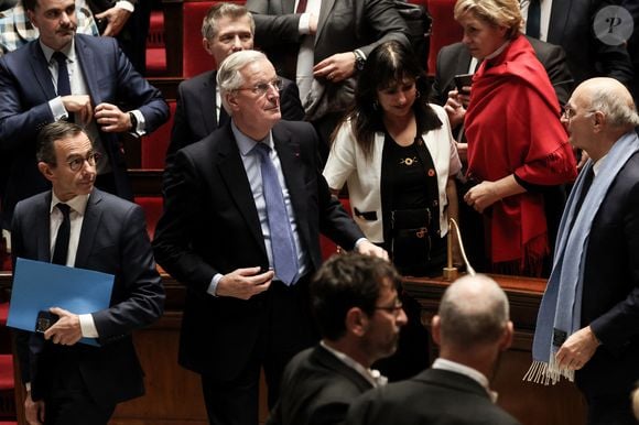 Le Premier ministre Michel Barnier, Bruno Retailleau et Didier Migaud lors d'un débat sur deux motions de censure contre le gouvernement français, déposées par l'alliance des partis de gauche le "Nouveau Front Populaire" (NFP) et le parti d'extrême droite Rassemblement National, après l'utilisation par le gouvernement français de l'article 49.3, une clause spéciale dans la Constitution française, pour faire passer le projet de loi de finances à l'Assemblée nationale sans un vote des législateurs, à l'Assemblée nationale à Paris, le 4 décembre 2024.   © Stéphane Lemouton / Bestimage