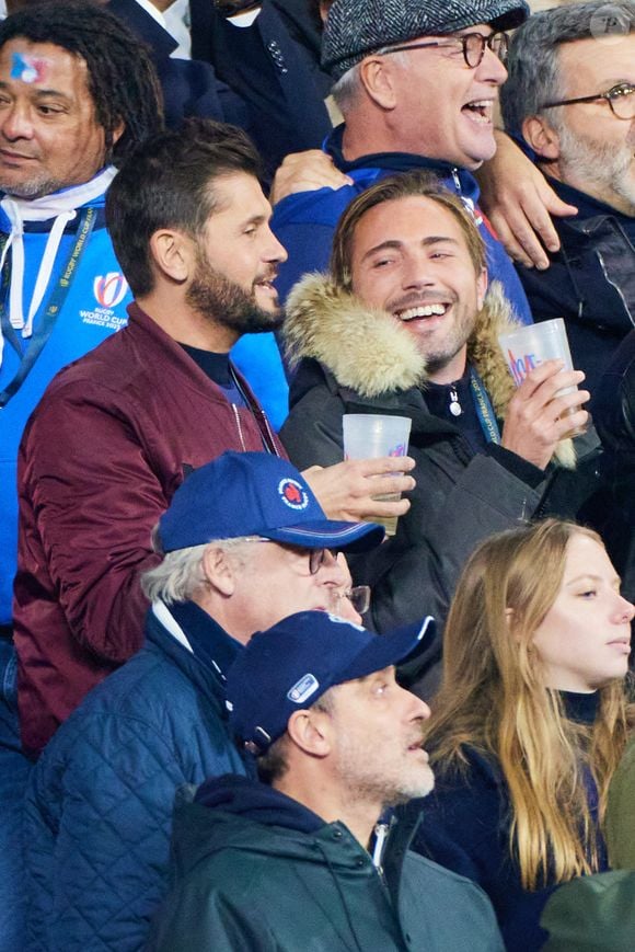 Christophe Beaugrand et son mari Ghislain Gerin dans les tribunes de la coupe du Monde de Rugby France 2023 - Match de quart de finale "France-Afrique du Sud (28-29)" au Stade de France à Saint-Denis 15 octobre 2023. © Moreau-Jacovides/Bestimage