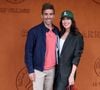 Une vidéo le dévoile d'ailleurs en pleine détente dans l'immense piscine chauffée.

Nolwenn Leroy et son compagnon Arnaud Clément au village lors des Internationaux de France de Tennis de Roland Garros 2025, à Paris, France, le 26 mai 2025. © Jacovides-Moreau/Bestimage