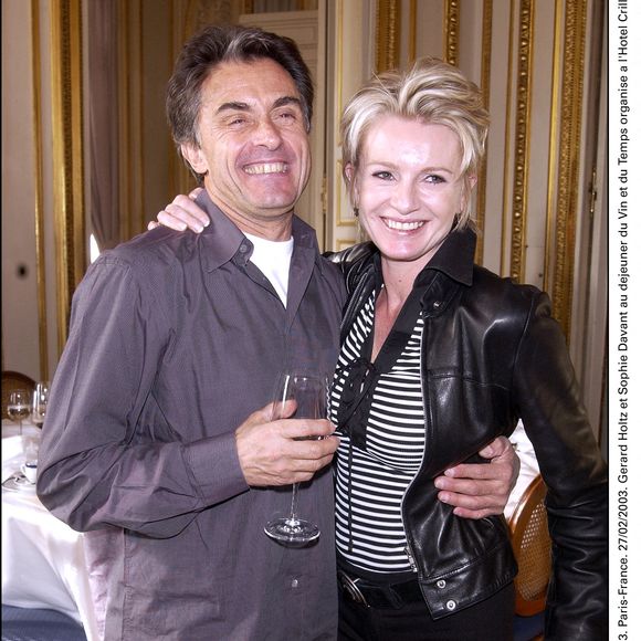 Gérard Holtz et Sophie Davant au déjeuner du Vin et du Temps organisé à l'Hôtel Crillon. 27 février 2003. © Serge Arnal/ABACA.