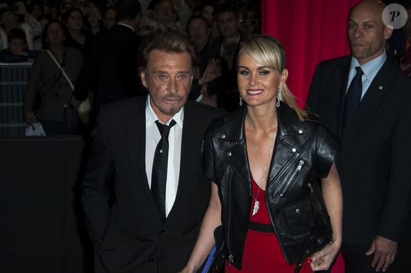 Johnny et Laeticia Hallyday assistant à la première du film 'Salaud On T?aime' qui s'est tenue au cinéma UGC Normandie à Paris, France le 31 mars 2014. Photo by Nicolas Genin/ABACAPRESS.COM