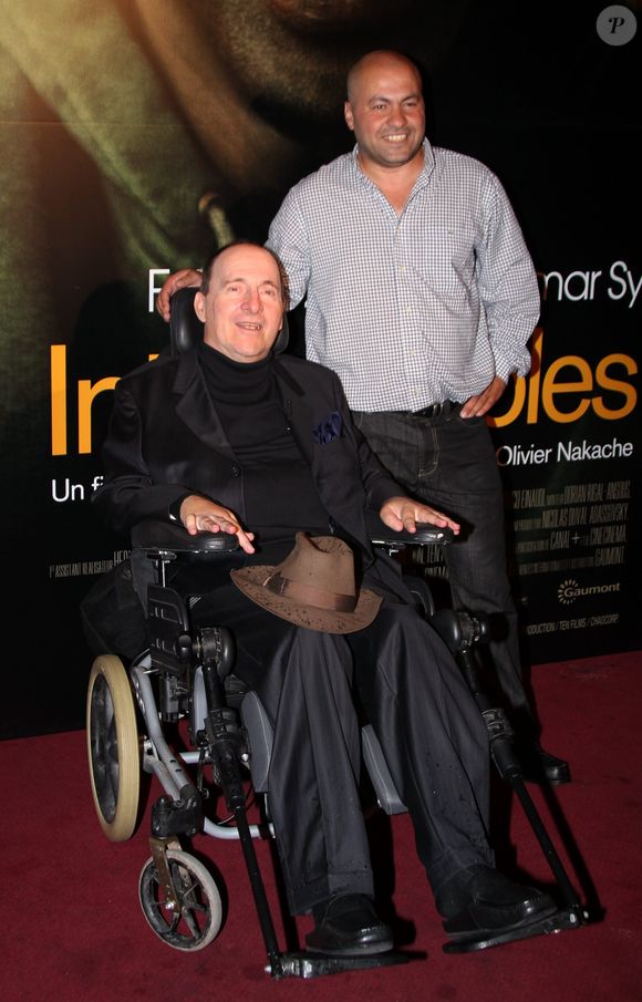 Philippe Pozzo di Borgo et Abdel Yasmin Sellou, qui ont inspiré le film "Intouchables", à l'avant-première du long-métrage au cinéma Gaumont Marignan, le 18 octobre 2011, à Paris. AGENCE / BESTIMAGE